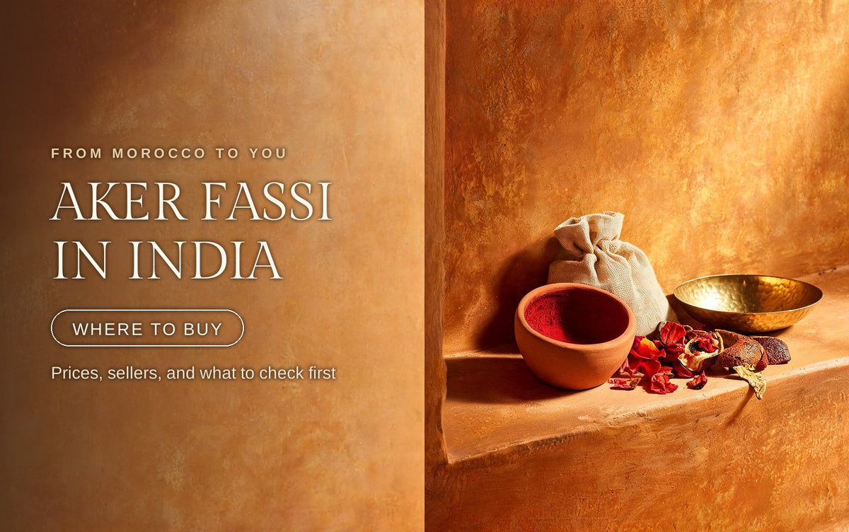 Terracotta aker fassi pot beside dried poppy petals and pomegranate rind on a warm clay ledge in golden light