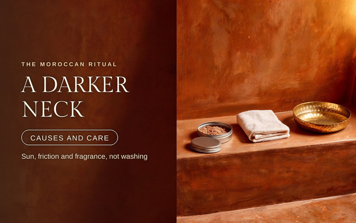 A small tin of fine face scrub, folded cream cotton cloth and a hammered brass dish in soft amber light