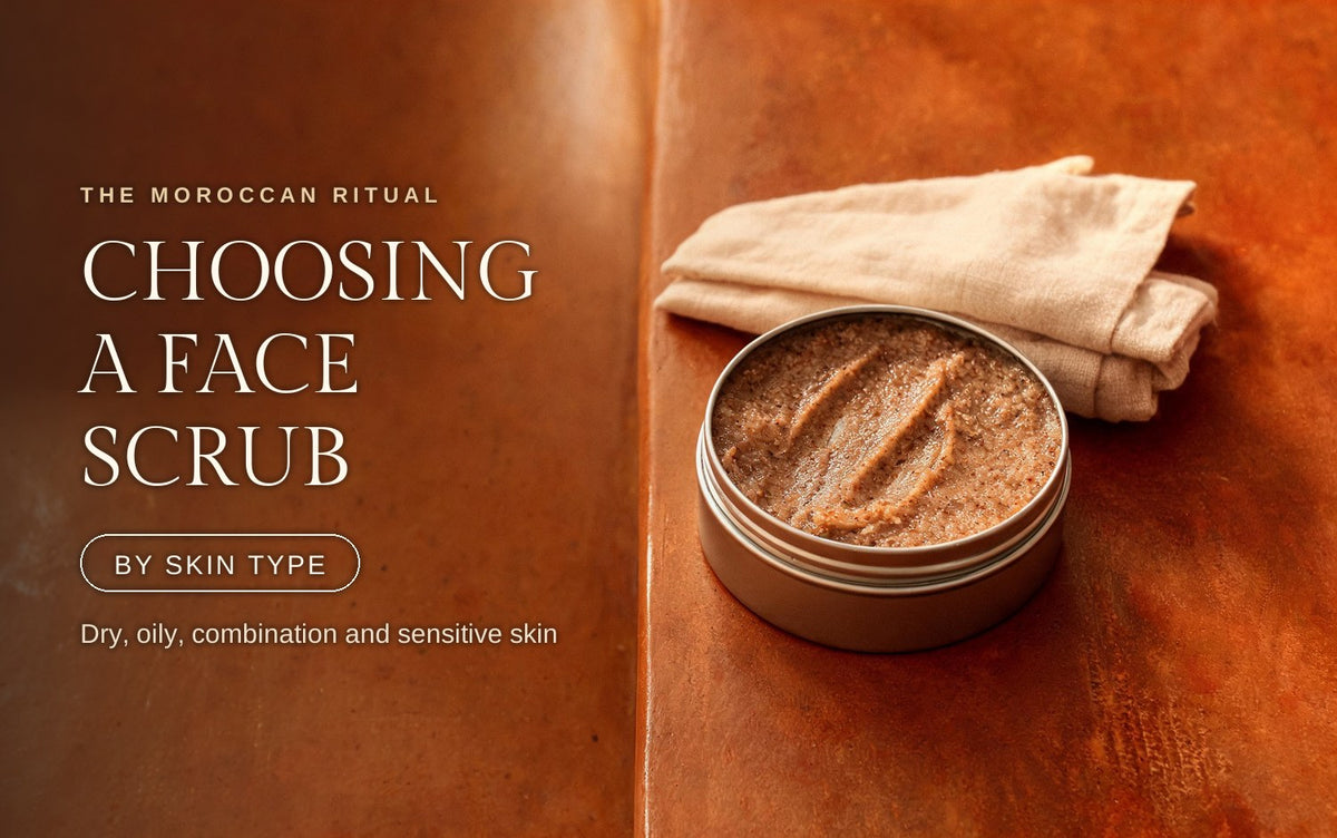 A small open tin of finely milled oil-based face scrub on a warm terracotta tadelakt ledge, one clean swipe drawn through the surface so the fine grain shows suspended in glossy oil, a folded muslin cloth resting behind it in soft amber light