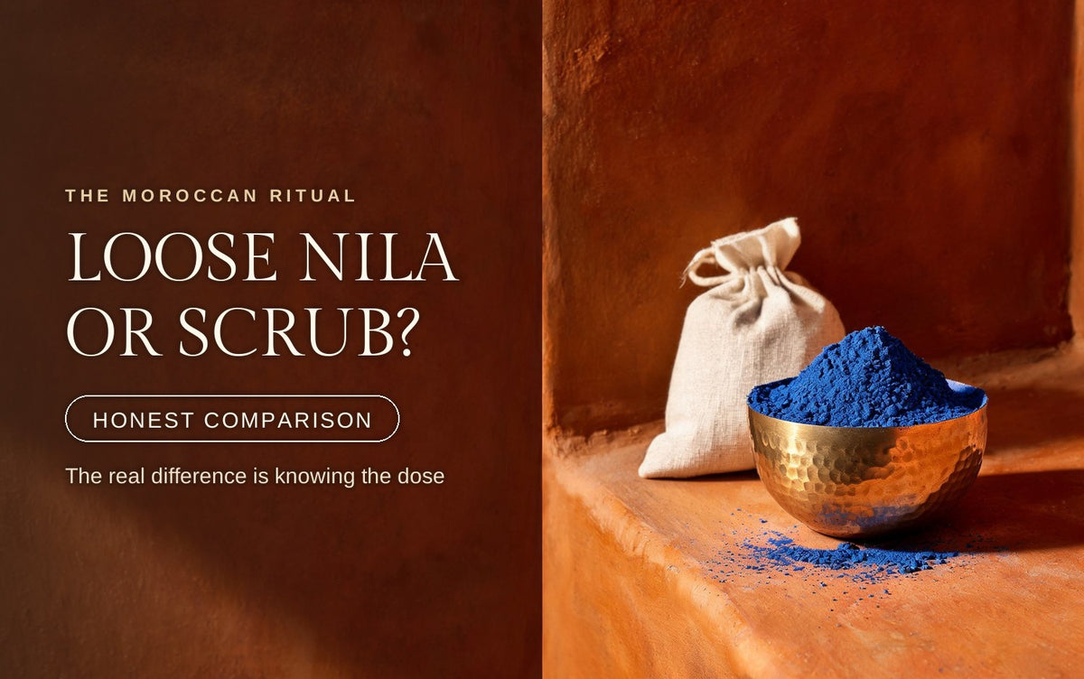 Hammered brass bowl heaped with ultramarine nila powder beside a linen pouch, blue pigment dusted on warm clay