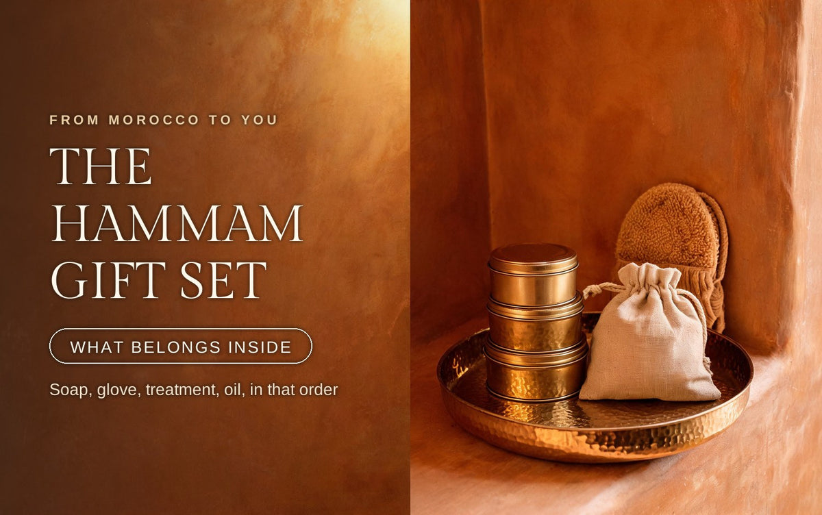 Stacked brass tins and a linen drawstring pouch on a hammered brass tray with a kessa mitt behind